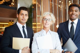 A team of vet sector professionals collaborate in a modern office setting.