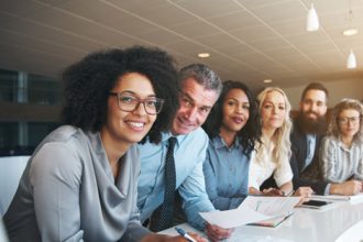 A business team discusses data, relevant to the Australian vet sector.