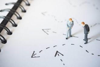 Miniature figures represent strategic planning for RTO training and navigating the vet sector.